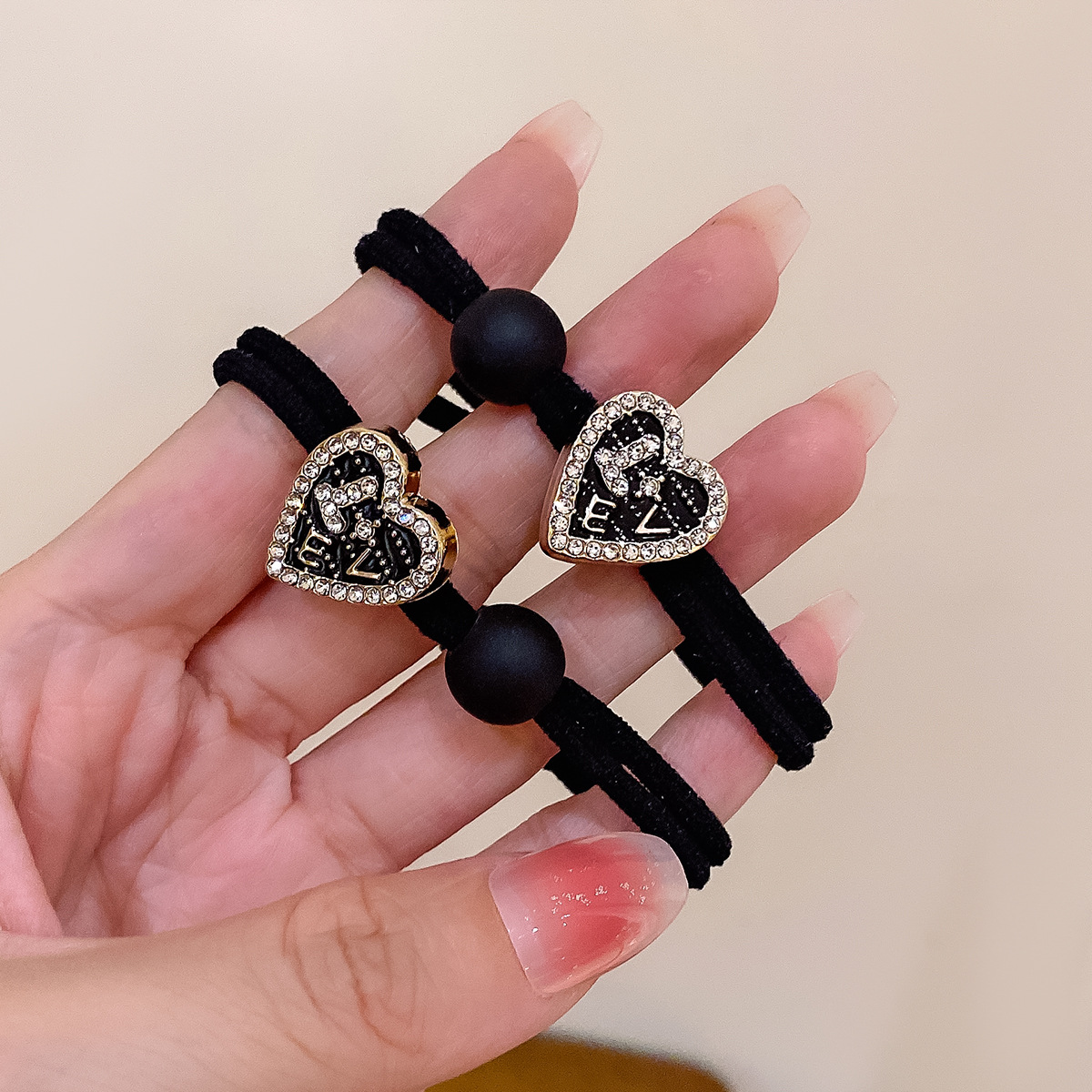 The fresh and cute heart-shaped hair band, the coffee-colored LOVE hair tie, and the adorable girl's ponytail hair tie are highly elastic and won't damage the hair's elastic bands Specification image