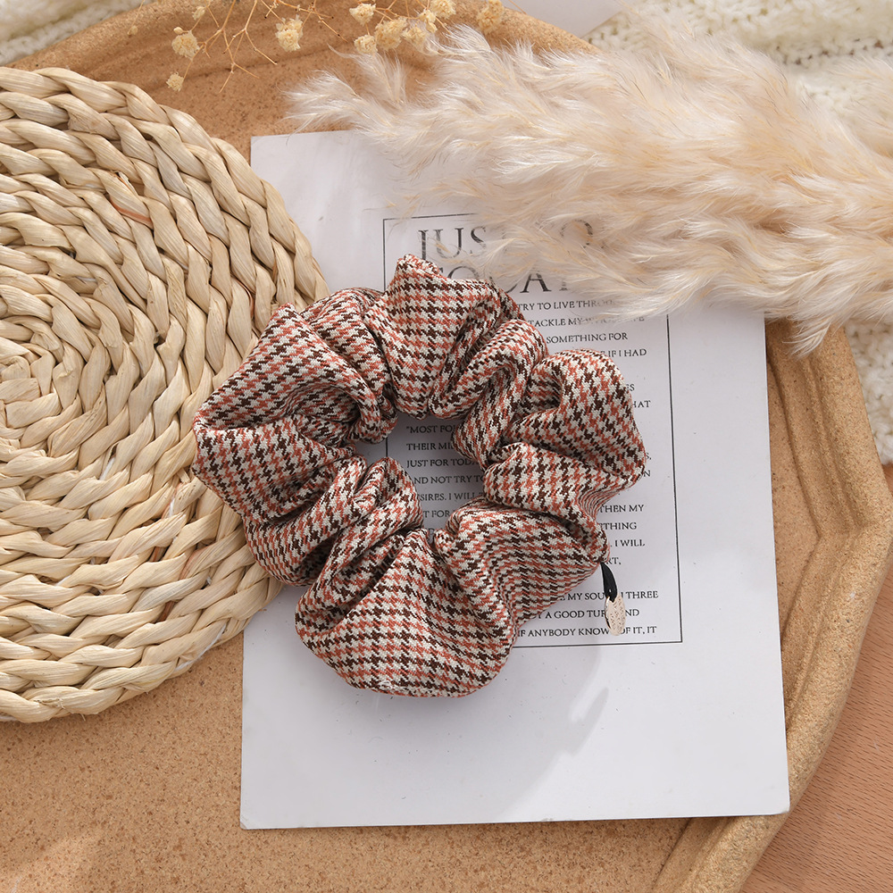 The 2023 new ins style simple hair band, retro check large intestine hair band, and thousand bird check striped large intestine hair band Application Scenario