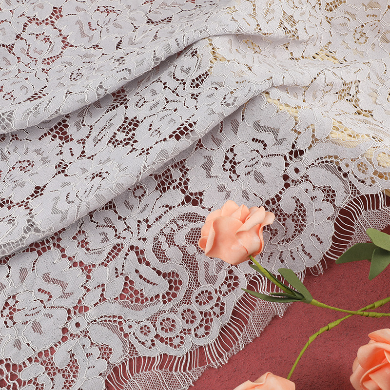 Grayish-white lace fabric