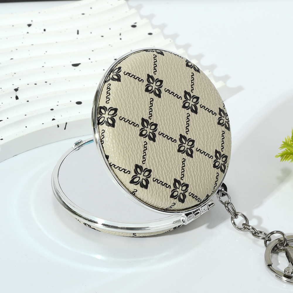 Small mirror, portable mini makeup mirror, portable round mirror, dual-purpose keychain, double-sided folding makeup mirror wholesale Application Scenario