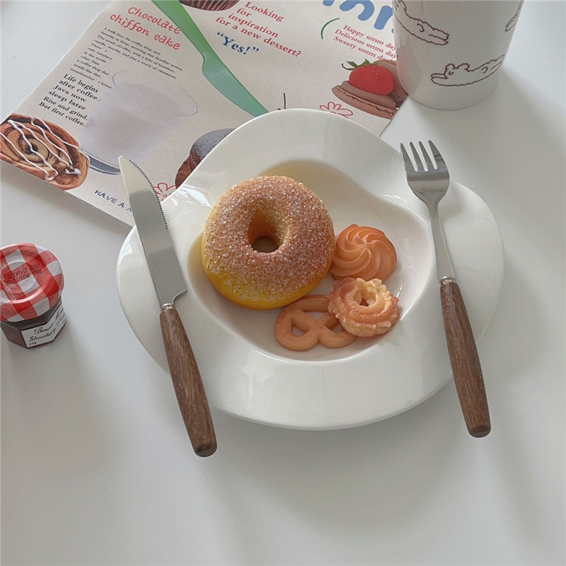 Stylish Wooden Handle Cutlery on a Dining Table