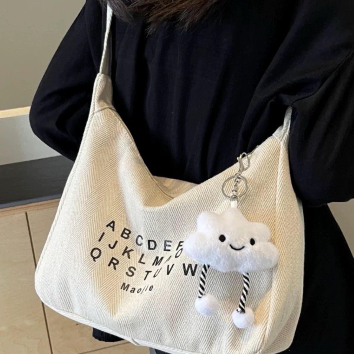 休闲帆布斜挎包女2025新款大学生上课潮牌小众百搭通勤单肩饺子包