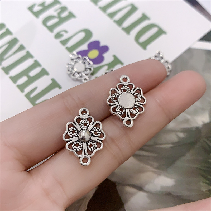 DIY zinc alloy jewelry accessories, double hanging hollowed-out flower simple necklace, bracelet, beaded connector, pendant Application Scenario