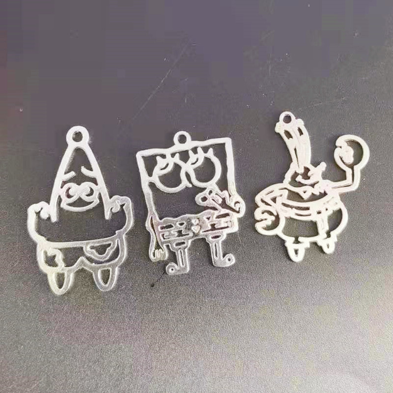 Wholesale of zinc alloy hollowed-out cartoon figurines, DIY keychains, pendants, necklaces, bracelets, decorative pendants, and accessories