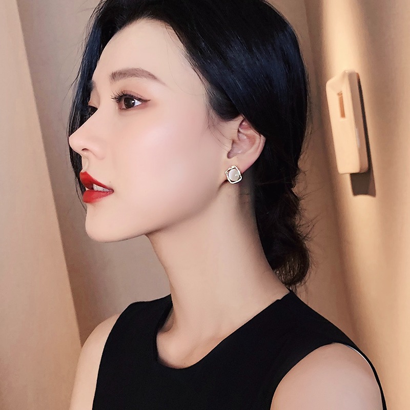 Cat's eye stone ear studs, 2025 new trendy and niche design earrings, high-end, elegant, light luxury and retro earrings for women details Picture