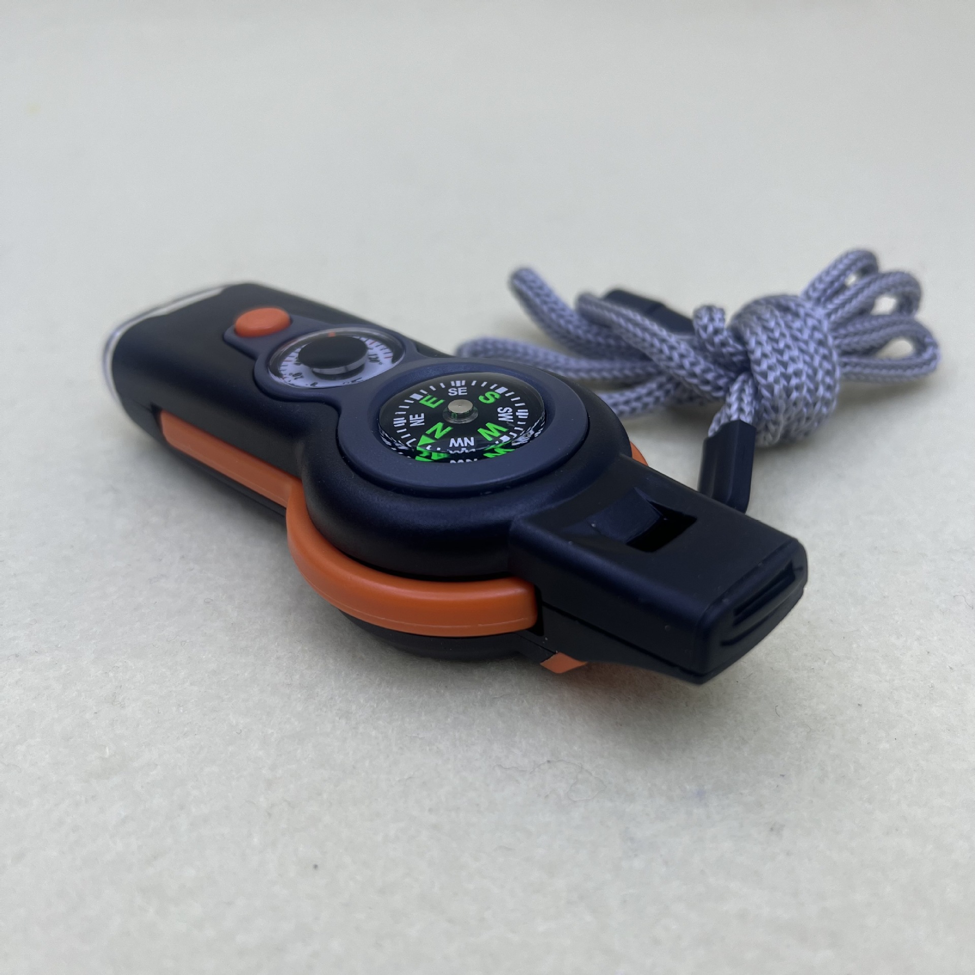 A new outdoor seven-in-one multi-functional whistle, compass, survival whistle with flashlight, thermometer and compass details Picture