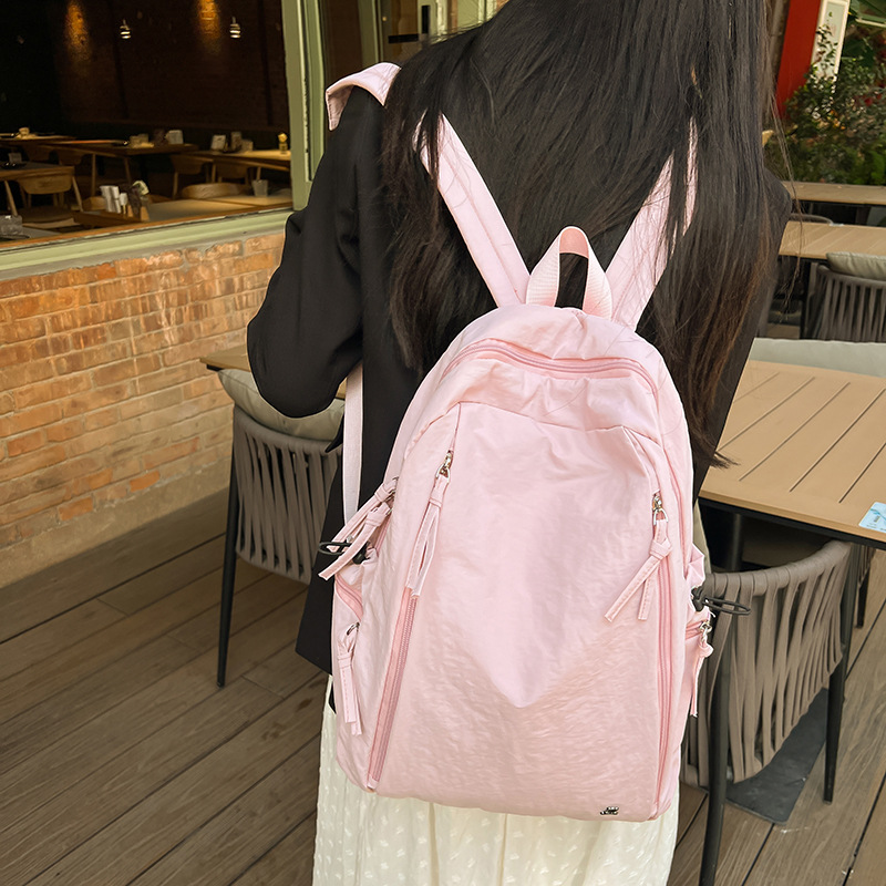 Female lightweight backpack for junior and senior high school students, Japanese-style casual schoolbag. Female college students, simple solid-color backpack. Female school style details Picture
