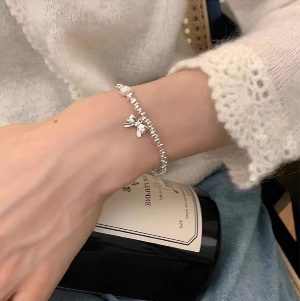 2023 New Broken Silver Pearl Bracelet Female Simple Cold Wind Bow Bracelet Niche Design Boudoir Hand Jewelry