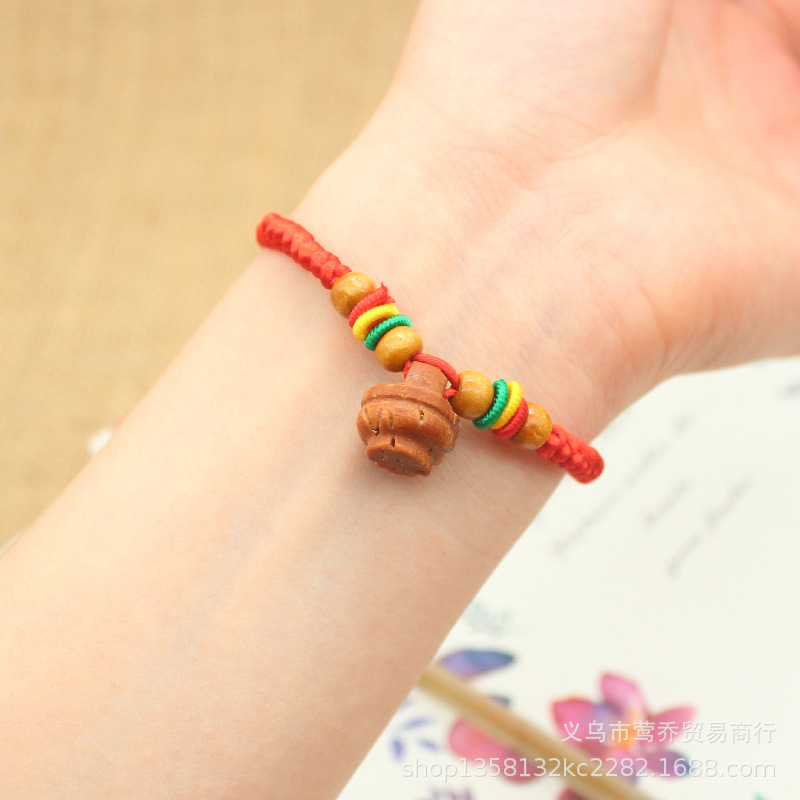 Shock baby bracelet baby's life year peach wood peach core Hu basket Dragon Boat Festival colorful red rope pig terror hand string gift Application Scenario