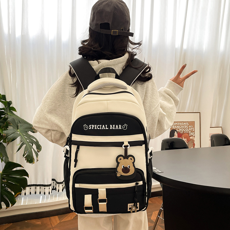 批发新款初高中学生大容量书包轻便减负背包小学生简约结实双肩包产品图