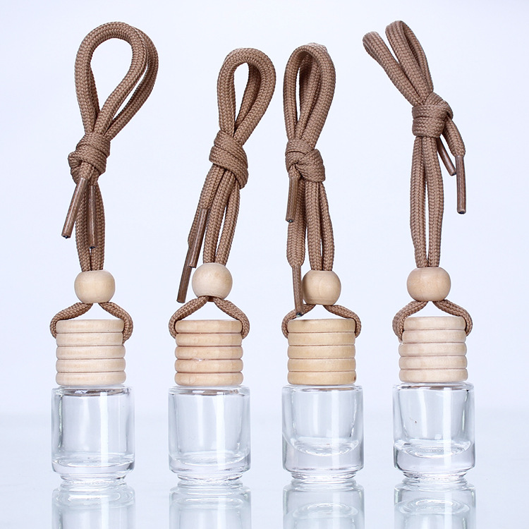 Cross-border wholesale 5ml creative wooden cap transparent pendant, essential oil pendant, glass cylindrical bottle, aromatherapy perfume empty bottle full figure