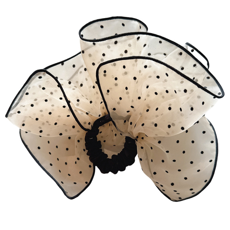 The new hair accessory from Dongdaemun, South Korea, features a stylish polka dot hair band with a high-end feel. It also offers a low ponytail and a hair tie for women Item Picture