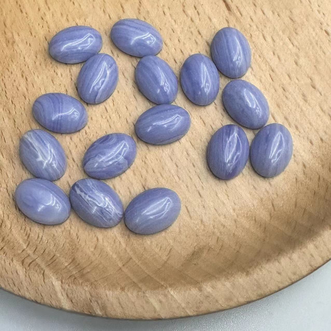 The manufacturer is selling a new type of synthetic purple agate Songdan shaped ring face, European and American fashionable crystal bare stone accessories wholesale loose beads Application Scenario