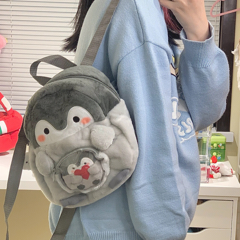 We have penguin cartoon backpacks, cute girls' backpacks, doll bags, plush mini schoolbags in stock details Picture