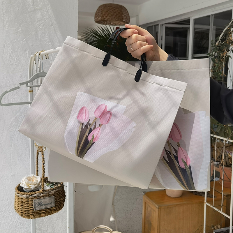 Tulip clothing store handbags, hand-carried clothes, packaging gifts, high-end non-woven fabric forked ear shopping bags