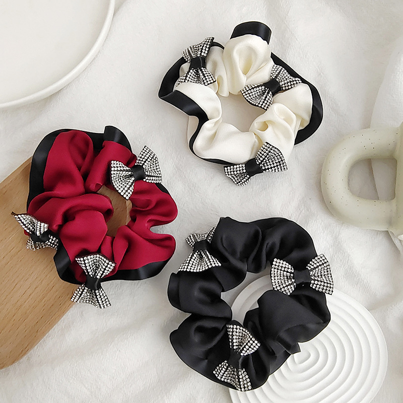 A new high-end texture single-sided linen bow with diamond-encrusted large intestine hair band and hair tie from South Korea, a popular hair accessory for women