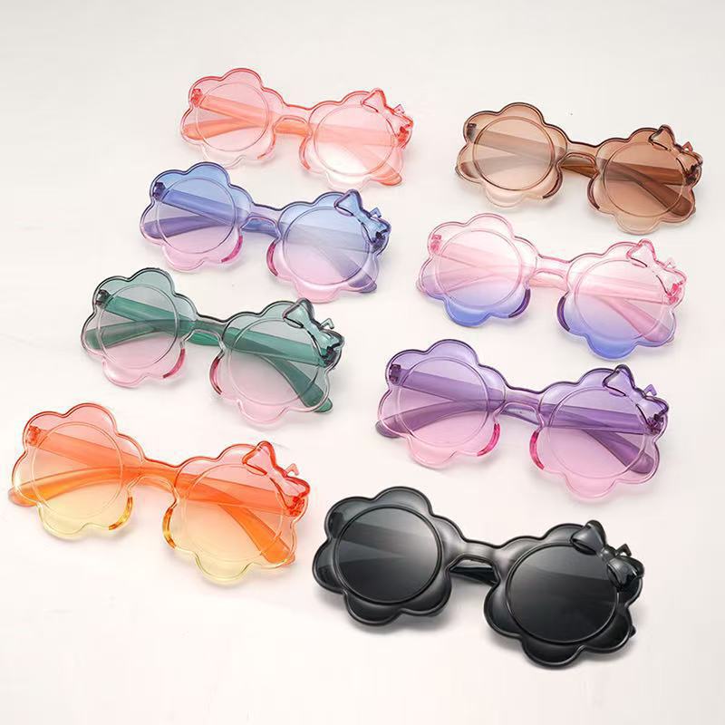 2025一体片彩色儿童太阳镜圆框小孩蝴蝶结眼镜防晒宝宝太阳花墨镜