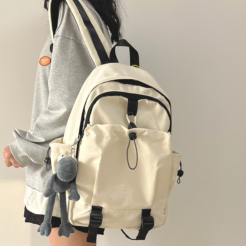 A simple and fashionable backpack for college students, junior high school and senior high school students, a trendy brand for women, a large-capacity casual travel backpack for men