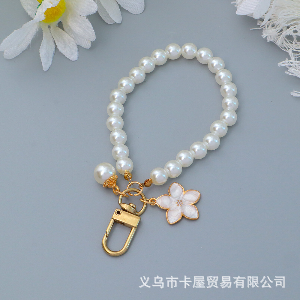 小香风新款珍珠花朵串珠挂件手机壳钥匙扣挂饰配件箱包挂链配饰女详情7
