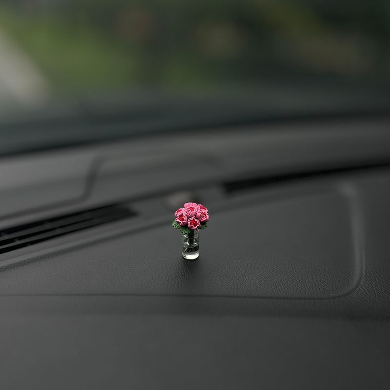 The charming rose-shaped car center console window decoration is a mini car accessory, making it unique and beautiful for ladies inside the car