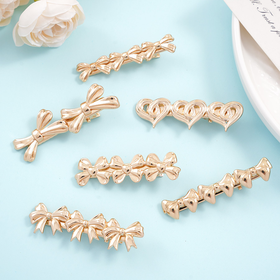 The new bow hair clips of the national trend series feature an InS-style niche design, hollowed-out heart-shaped duckbill clips, side hair clips and bangs clips details Picture