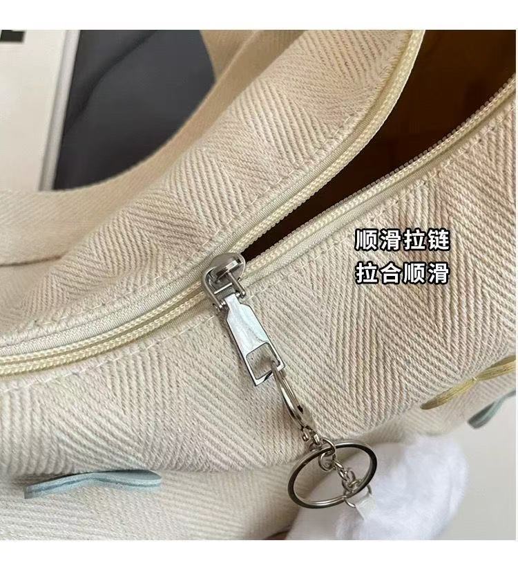 休闲帆布斜挎包女2025新款大学生上课潮牌小众百搭通勤单肩饺子包详情8