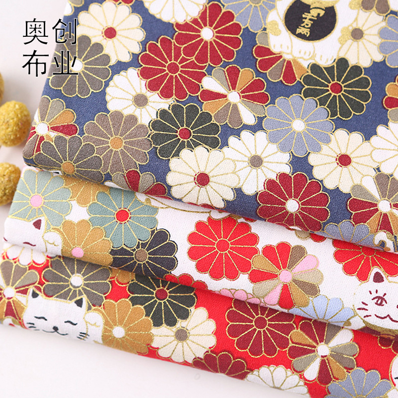 Japanese-style Maneki Neko printed gold-embossed fabric, Japanese-style flower bags, sachets, cute cartoon clothing fabric details Picture