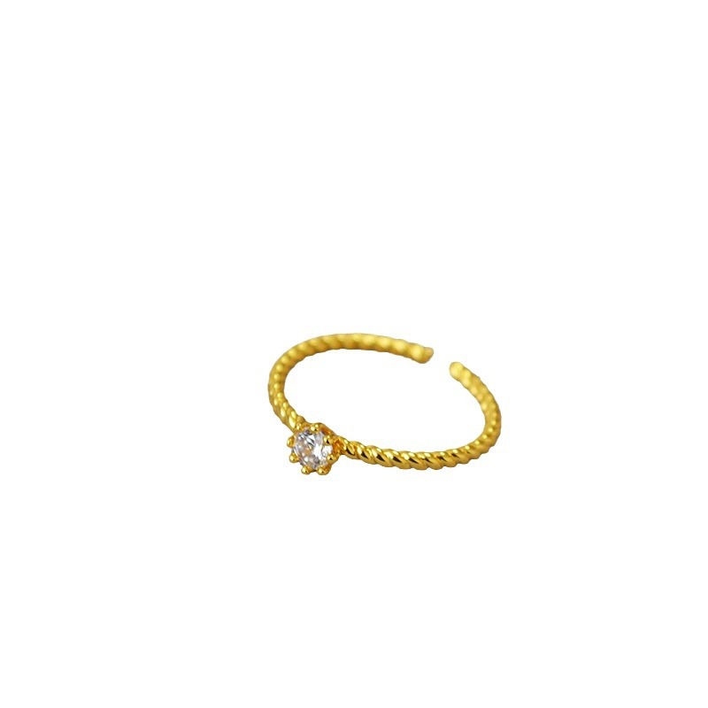 A small and simple Japanese and Korean brass gold-plated twist eight-prong ring with zircon flash diamonds and adjustable opening for the index finger ring Item Picture