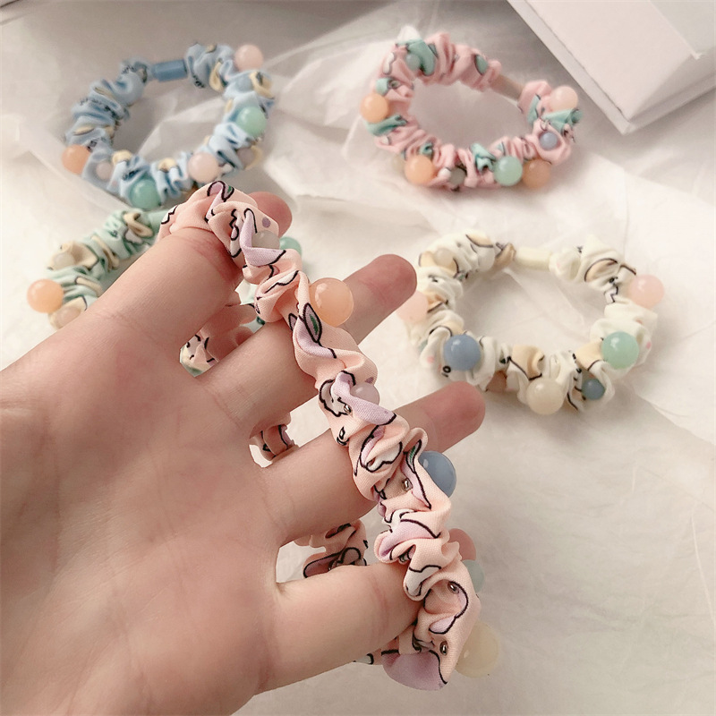 Early spring new trendy high-end feminine charm pearl small intestine hair band tie hair band large intestine hair band hair accessory for women Application Scenario
