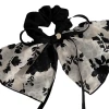 A new retro and high-end hair tie with a French elegant flower ribbon bow and a large colon hair band for women. A gentle headwear for women Item Picture