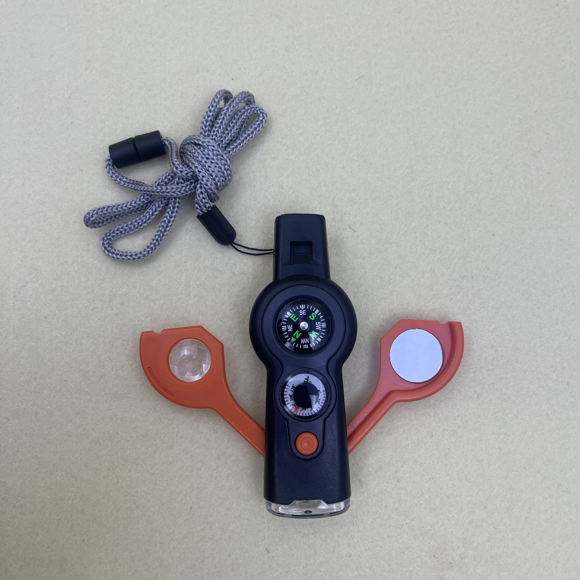 A new outdoor seven-in-one multi-functional whistle, compass, survival whistle with flashlight, thermometer and compass Application Scenario