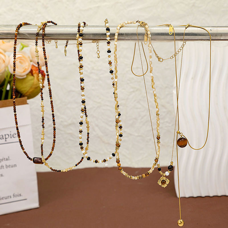 New high-end autumn and winter necklaces and pendants, a niche female Maillard beaded tiger's eye pearl necklace and pendant details Picture