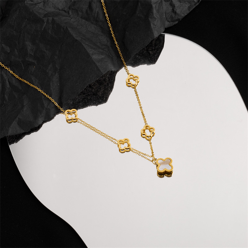 A niche design double-sided four-leaf clover titanium steel necklace with a fashionable and elegant feminine touch, featuring a light luxury hollowed-out flower mother-of-pearl collarbone chain and a personalized accessory details Picture
