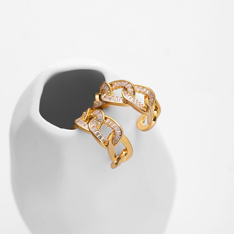 Nasha European and American copper-plated 18K real gold interlocking earrings for women with micro-inlaid zircon gold plating, high-end and niche earrings details Picture