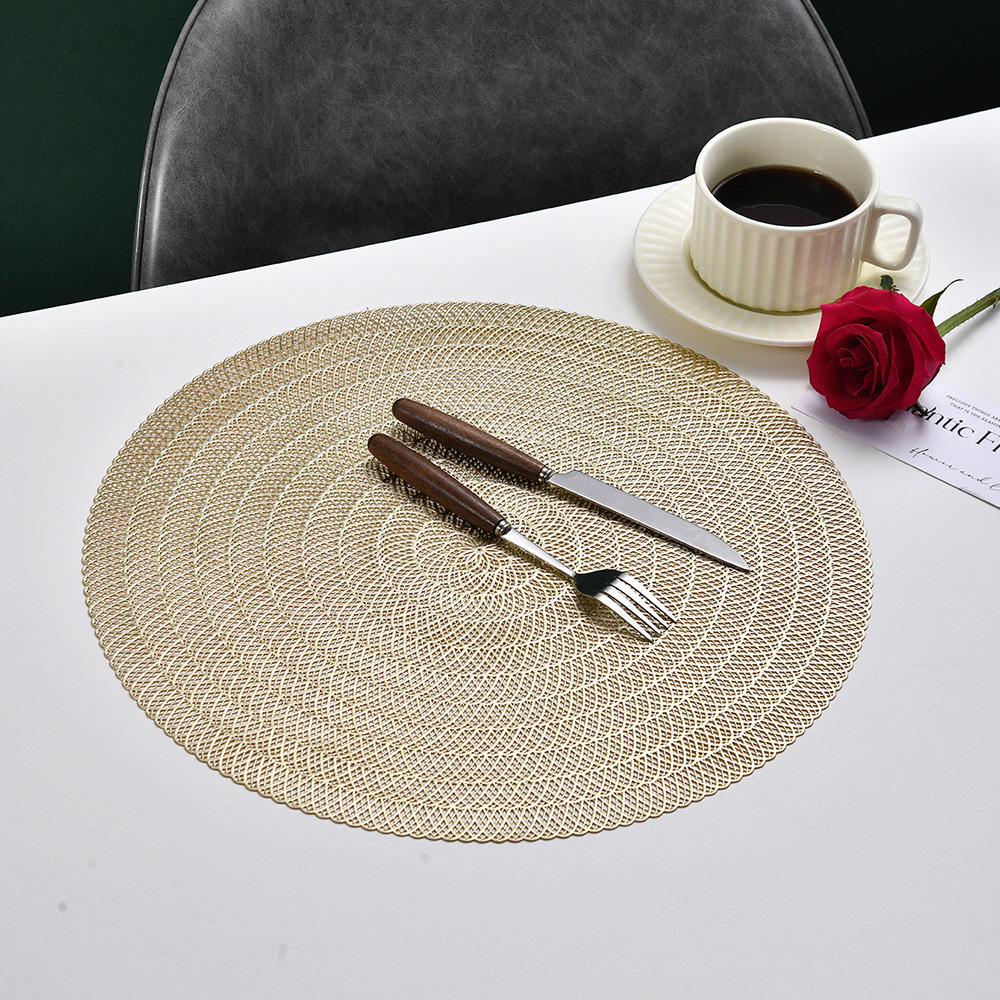 Wholesale of European-style circular hollowed-out table MATS, PVC gold-embossed creative table decoration table MATS, waterproof, anti-slip and heat-insulating placemats