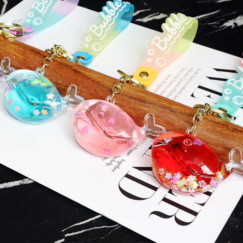 Sand bottle with oil, dolphin and whale keychain, luminous snowflake, sparkling message bottle, exquisite children's schoolbag, small pendant details Picture