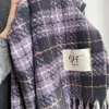 The taro purple checkered scarf exudes a Korean-style atmosphere for women, providing warmth and whitening effects. The soft tassel shawl and the fashionable faux cashmere scarf details Picture