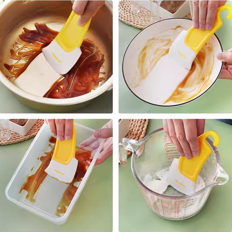 Yellow silicone scraper for cleaning the bottom of kitchen stoves, pans and plates, soft scraper, high-temperature resistant scraper blade, kitchen tools Application Scenario