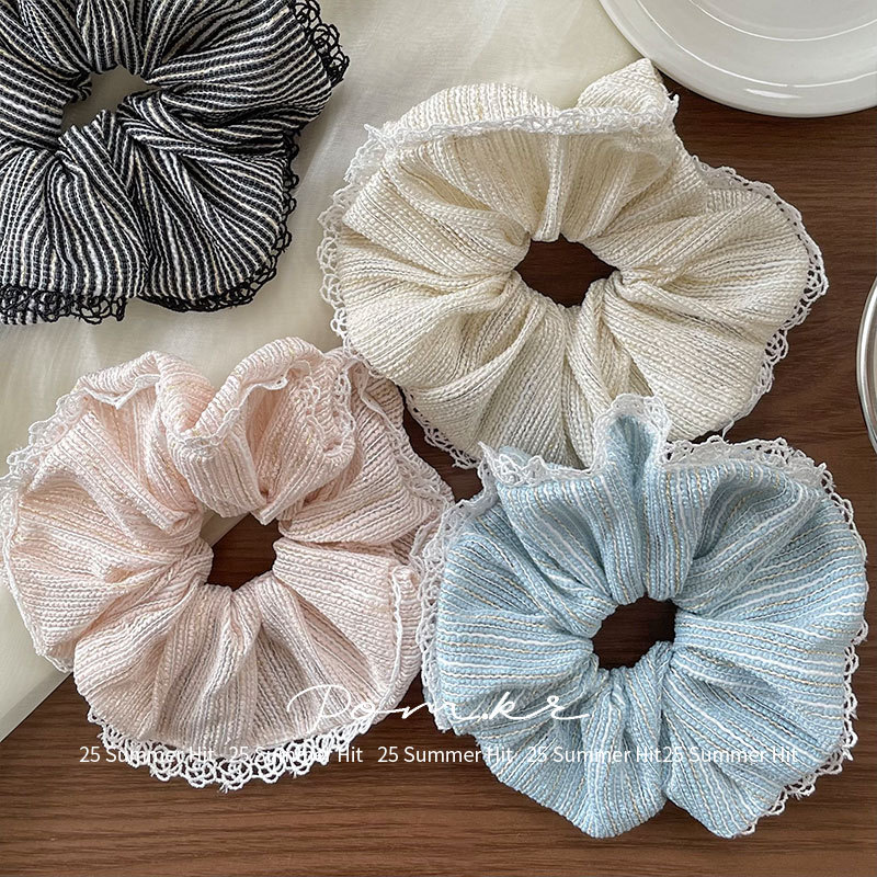 The new Korean-style simple and elegant lace-trimmed large intestine hair band is a versatile accessory for girls. The retro high-elasticity bun hair is perfect for women