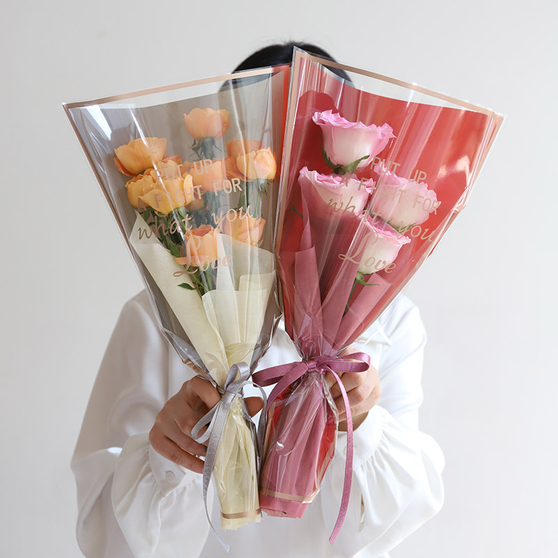 Simple frame Phnom Penh multi-branch bag transparent flower packaging printed word waterproof bouquet packaging Goddess Festival single bouquet packaging details Picture