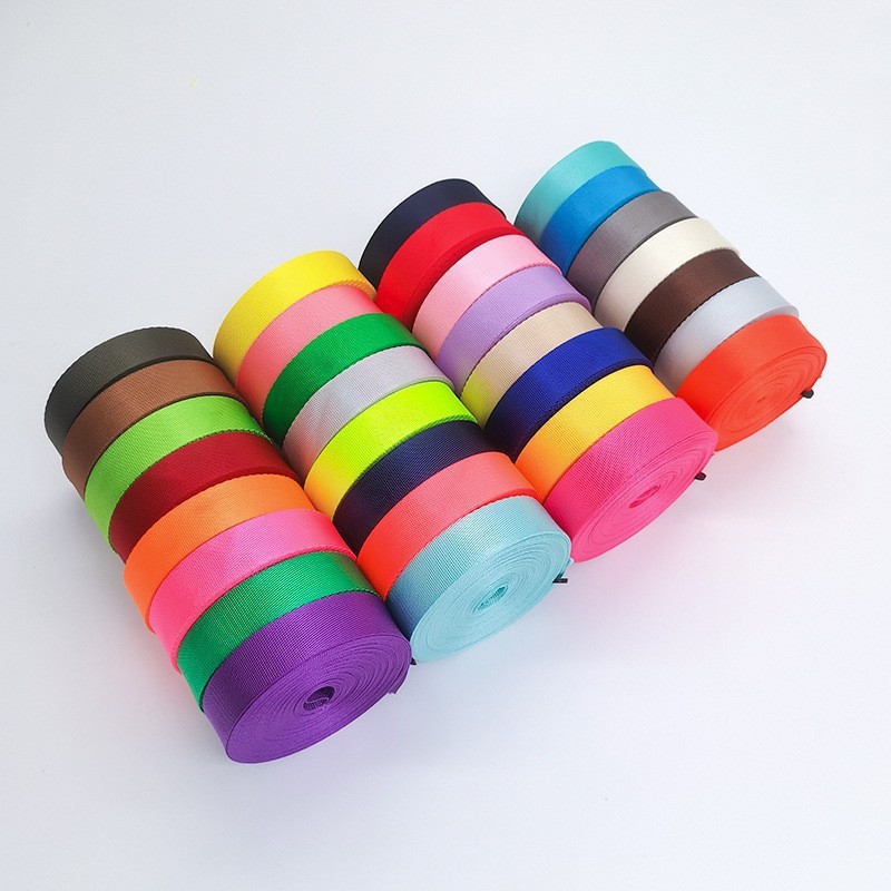 Wholesale of webbing, including imitation nylon weave webbing, polyester webbing and plain weave webbing. Large quantities in stock with complete colors and specifications
