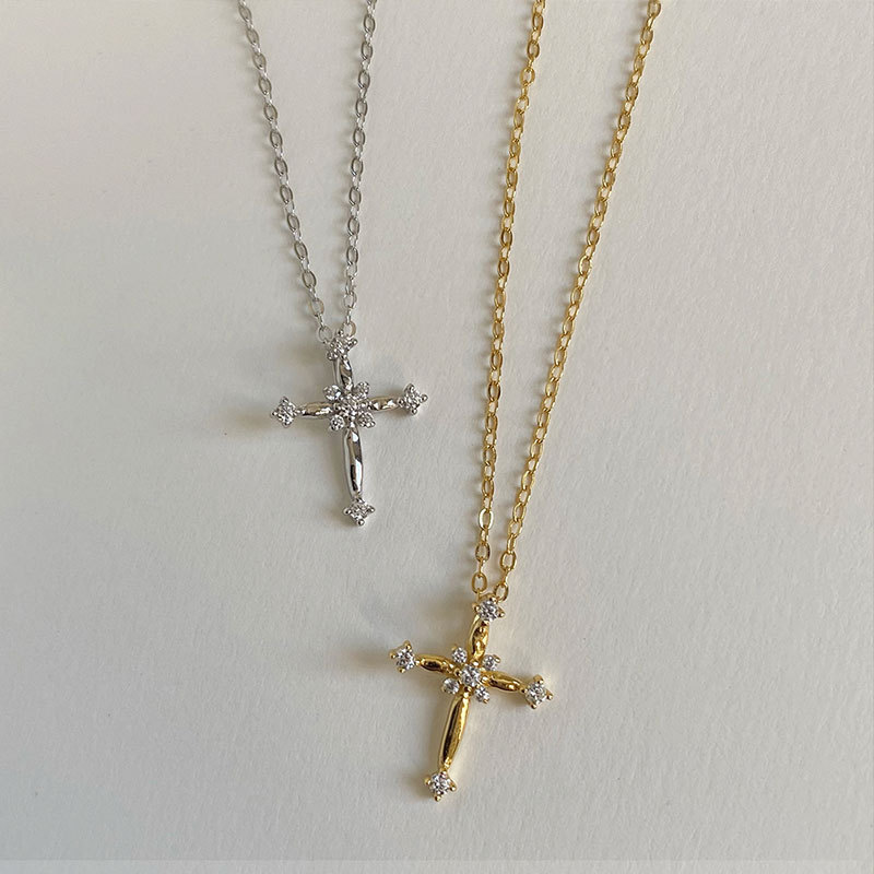 The cross-shaped necklace is a light luxury and niche design for women. It features a full diamond collarbone chain and a stylish stainless steel accessory. New style for 2024