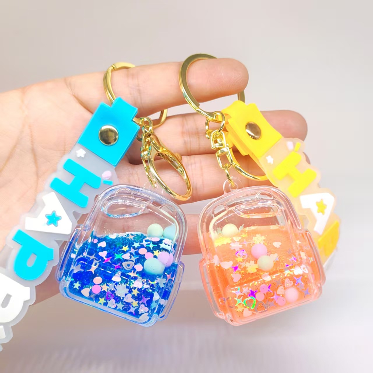 卡通炫彩流沙书包瓶钥匙扣汽车背包情侣手机入油液体潮玩网红挂饰