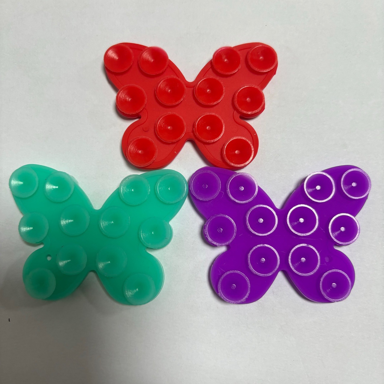 The factory sells multi-functional silicone double-sided adhesive suction cup mobile phone stick butterfly granule self-adhesive mobile phone bracket Specification drawing
