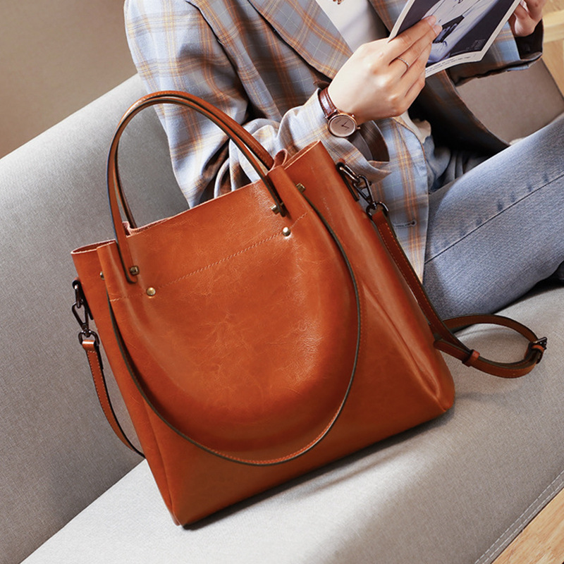 Leather women's bag 2023 new style fashionable women's bag, large capacity hand-held crossbody bag, bucket bag, niche design large bag