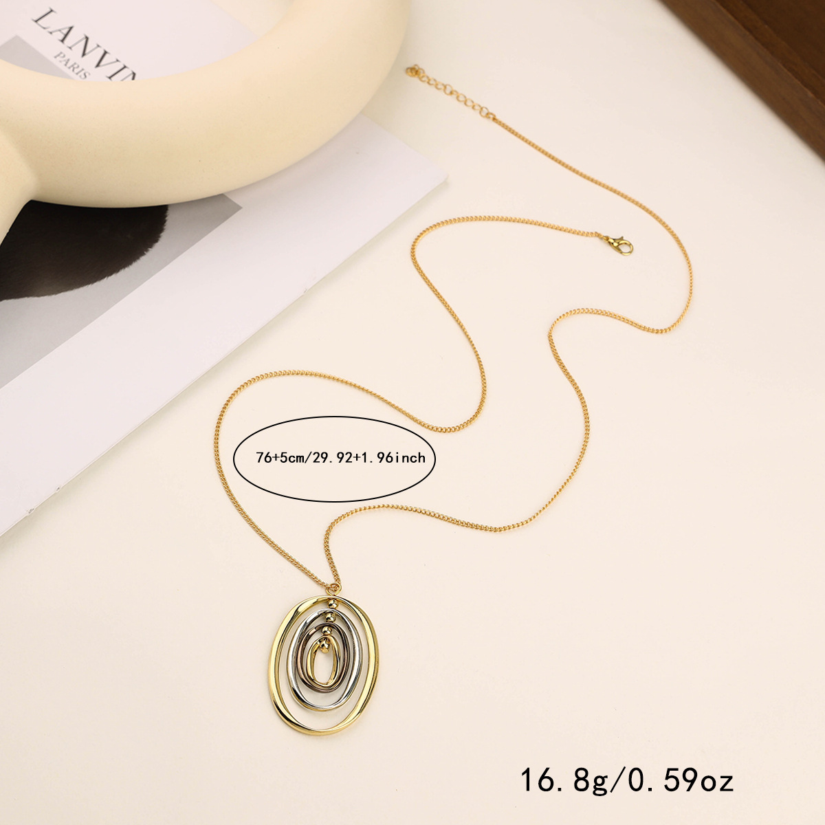 Simple High-Level Multi-Layer Oval Alloy Necklace Cross-Border Long Ring Pendant Female Collarbone Chain Manufacturers Direct Sales Application Scenario