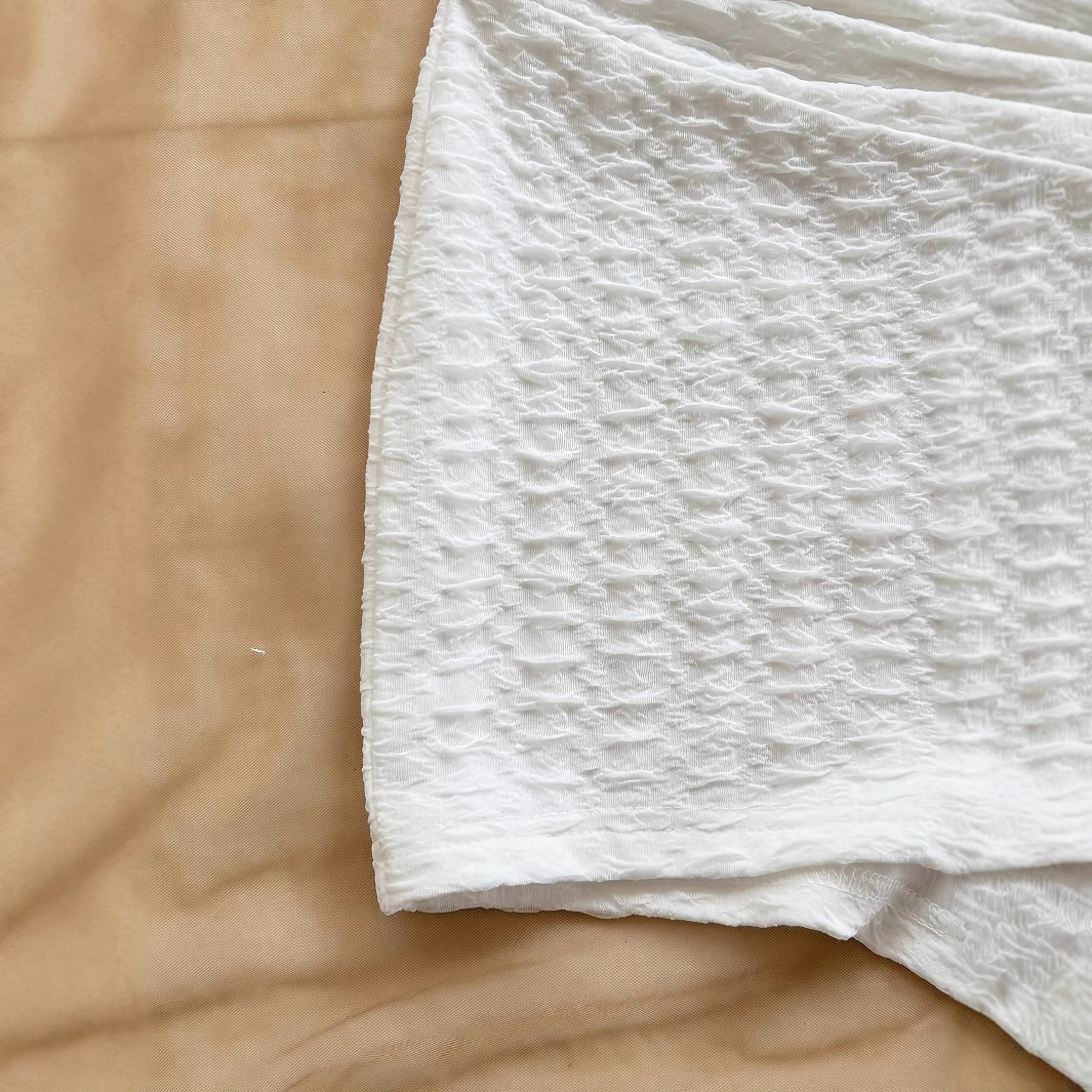 In 2025, a cross-border bestseller in Europe and America, the white women's vacation white knitted texture metallic texture slimming jumpsuit Application Scenario