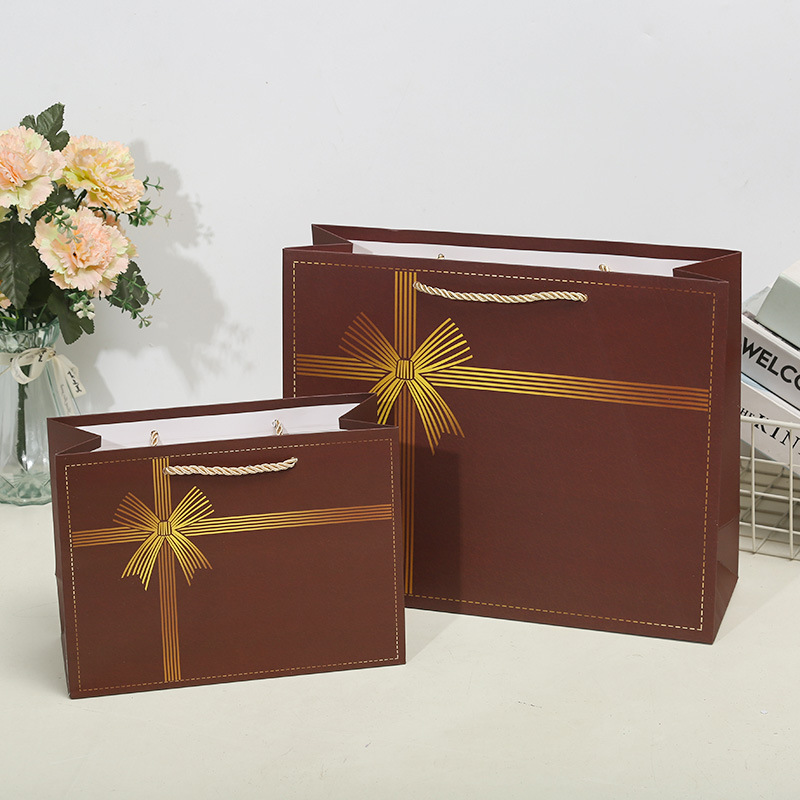 Horizontal ribbon bow gift bags, handbags, paper bags, clothing, shopping bags, birthday return gifts, souvenirs, South American Specification image
