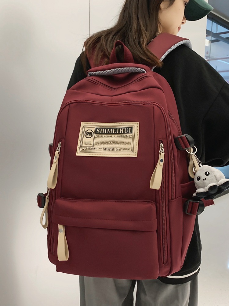 Spring and summer simple travel computer backpack, casual solid color label double-shoulder large capacity schoolbag for junior and senior high school students