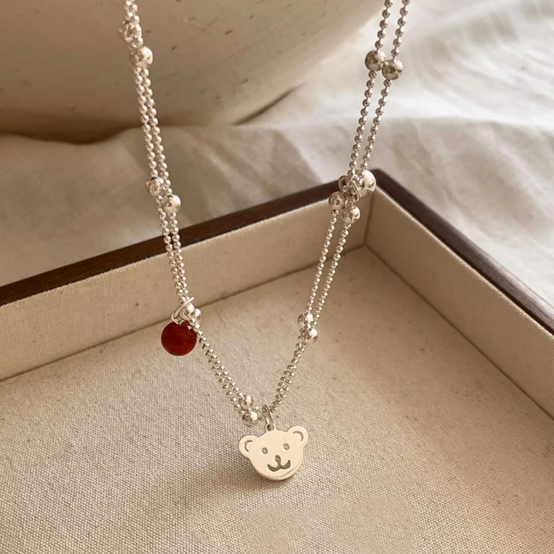 The new S925 sterling silver double-layer bear red agate necklace for women is a light luxury Instagram niche collarbone chain with a high-end and elegant style pic 2